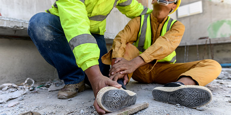 man with hurt foot due to improper footwear safety